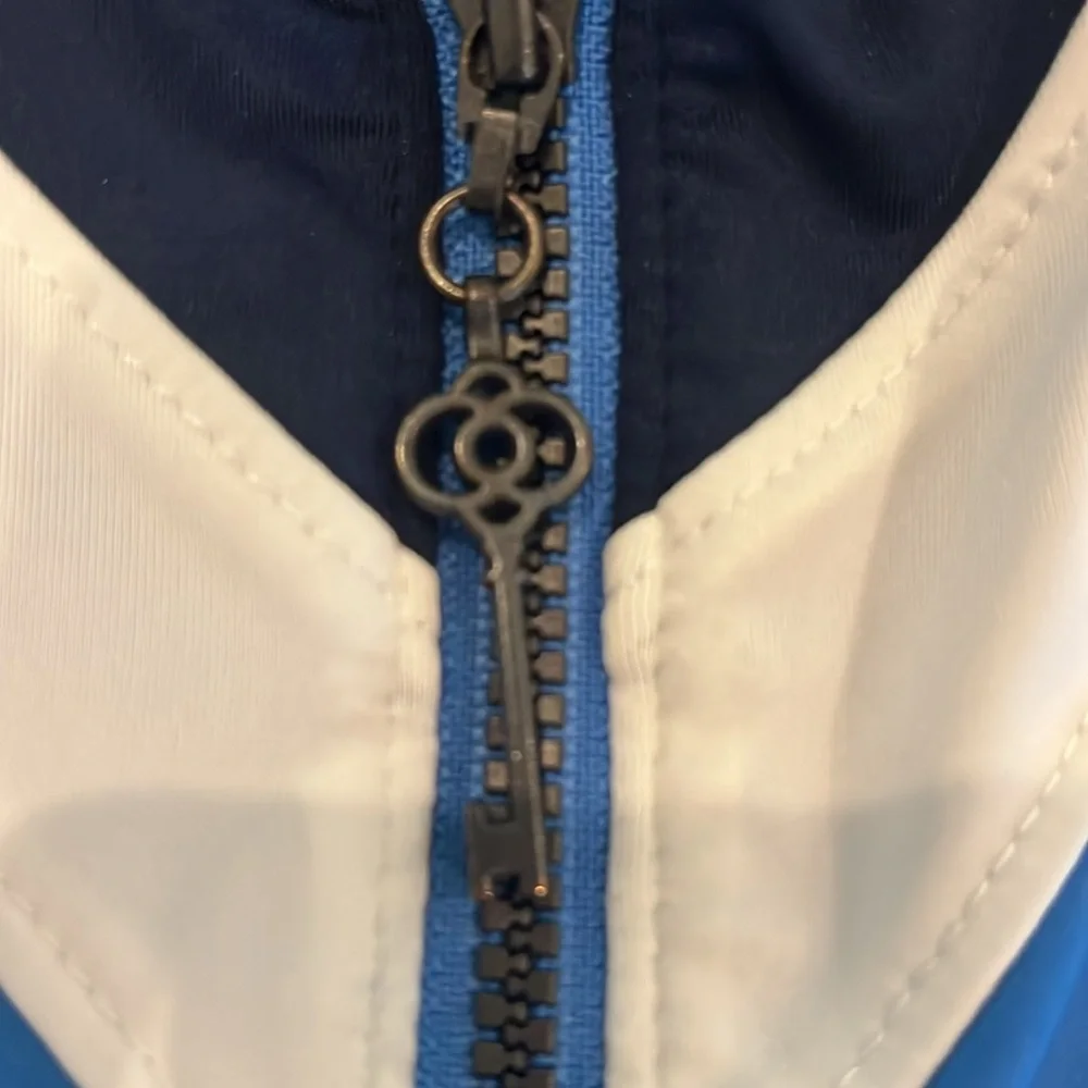 Blue Sleeveless golf Top with navy and White Accents. - Picture 4 of 5